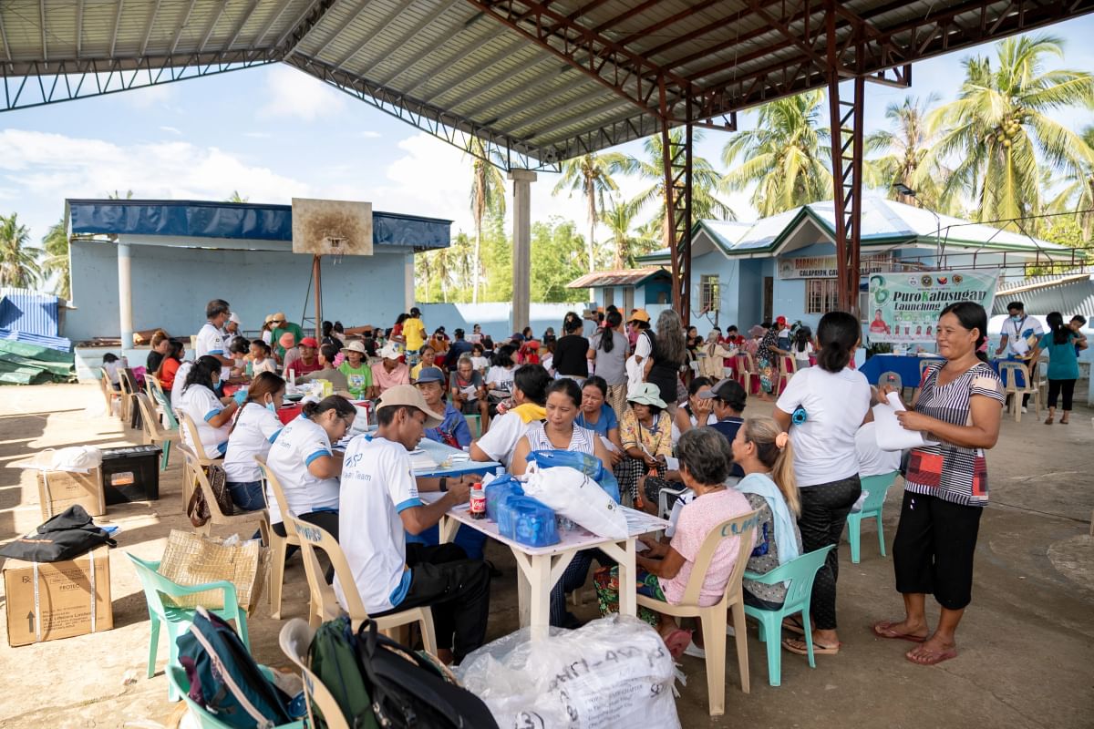 A medical outreach session at a covered court which was damaged by Typhoon Opong