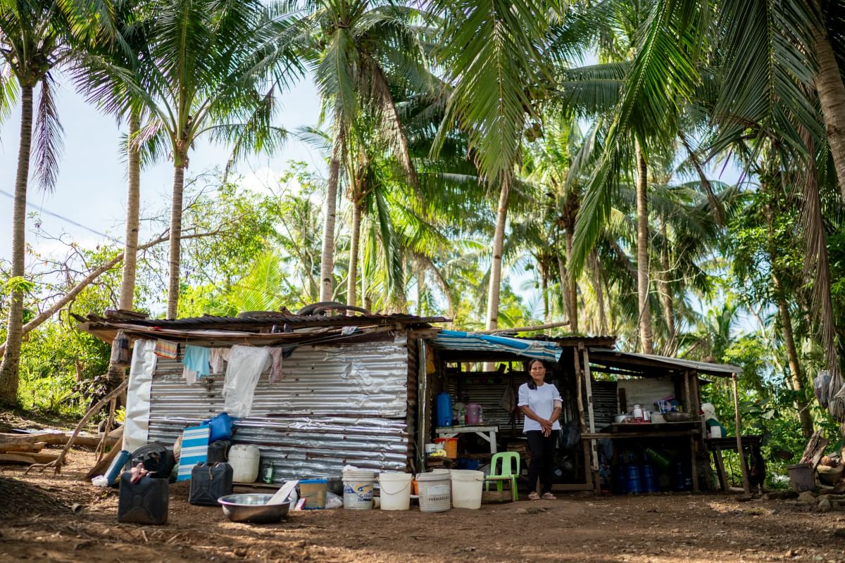 Marites outside her makeshift home in Masbate province, Philippines