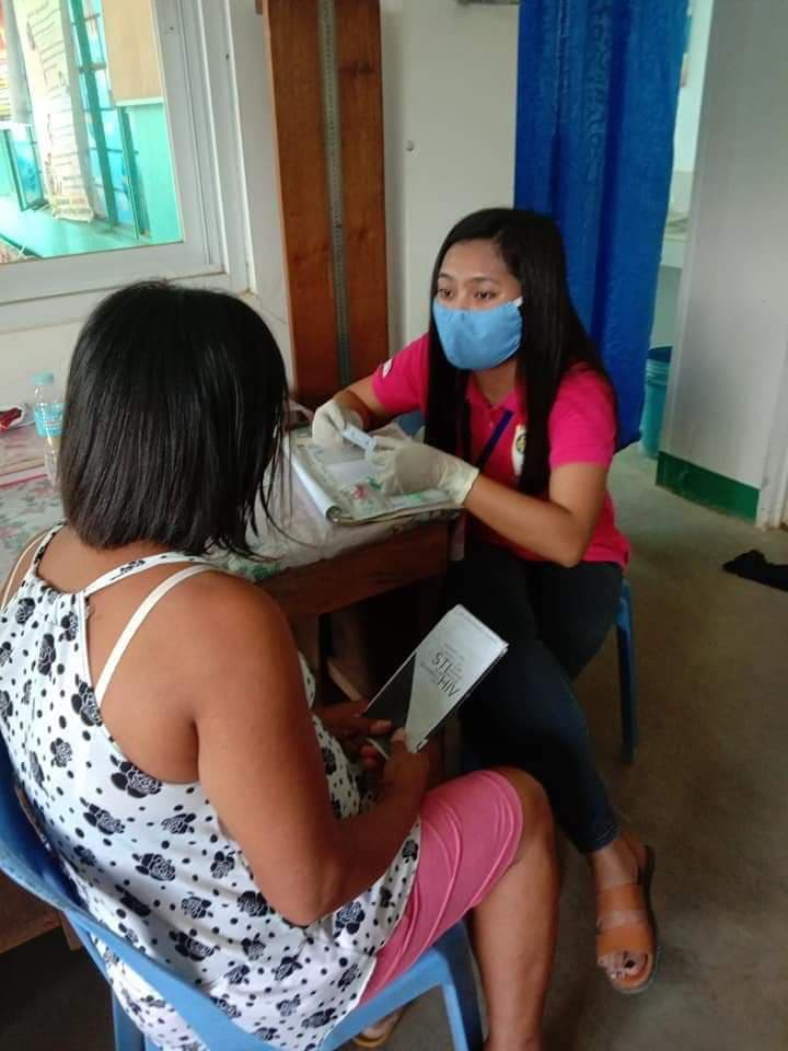 Renee Josephine Havana, FPOP MASBATE youth volunteer, assisting in CBS HIV rapid screening