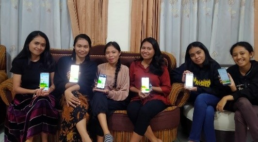 a group of girls sitting in a row