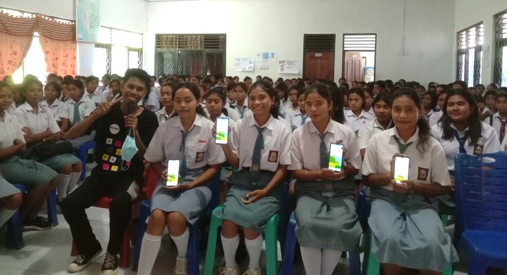 a group of girls sitting in a row