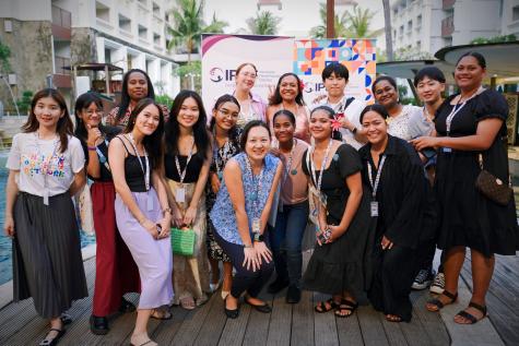 A group of women from diverse contexts posing for a photo