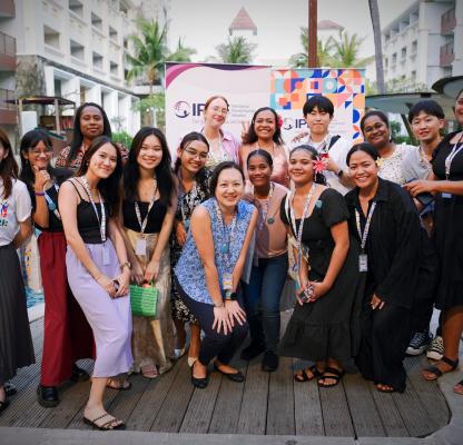 A group of women from diverse contexts posing for a photo